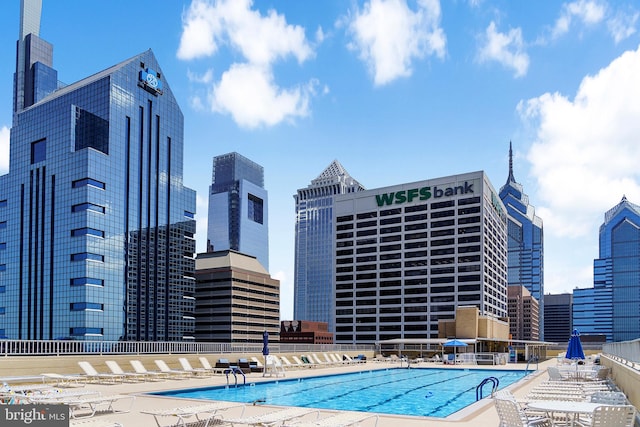 community pool with a city view
