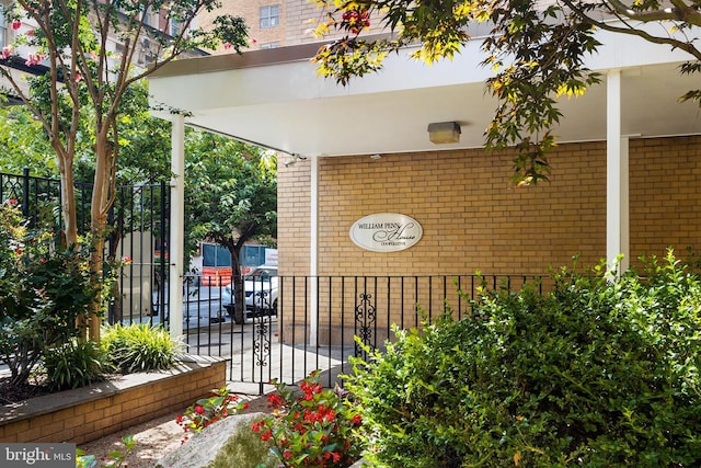 view of patio with fence and a gate