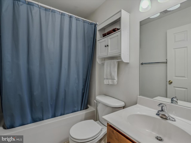 full bathroom with shower / bath combination with curtain, toilet, and vanity