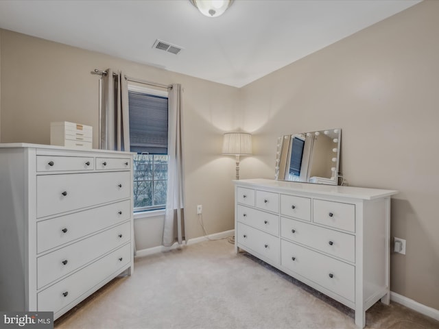 bedroom featuring light carpet