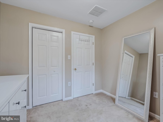 unfurnished bedroom with light carpet