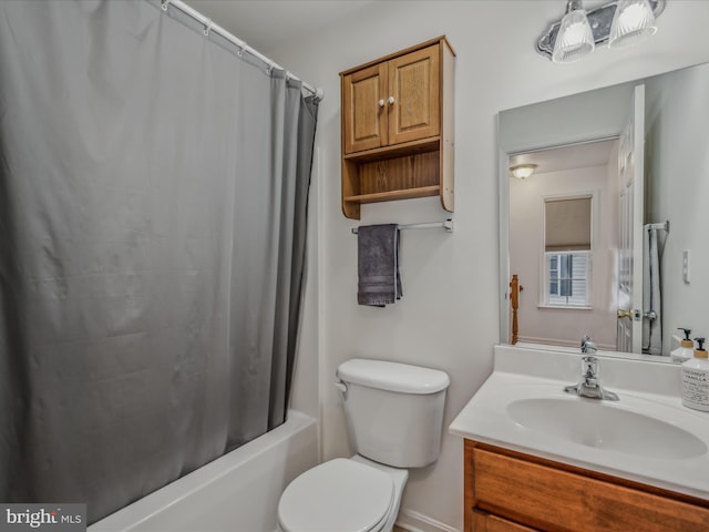 full bathroom with shower / tub combo, vanity, and toilet