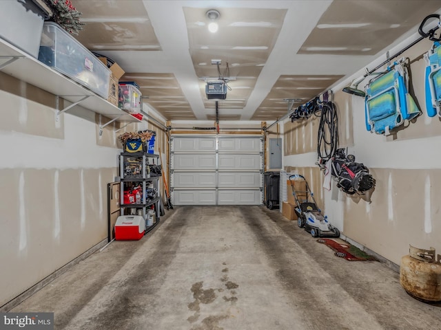 garage with electric panel and a garage door opener