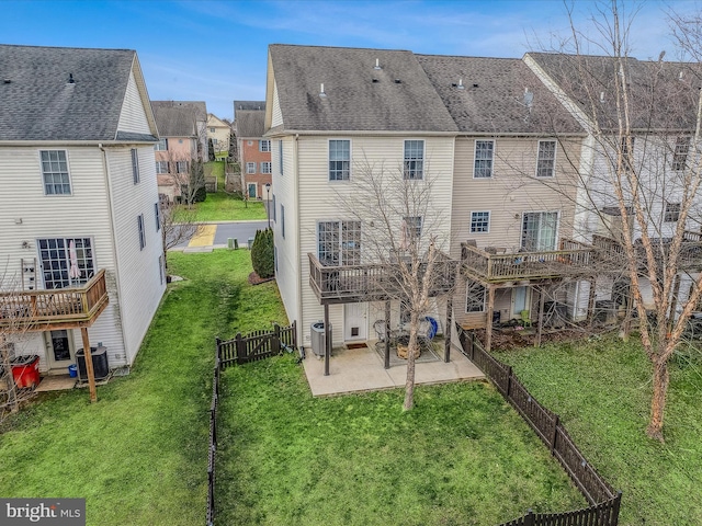 back of property featuring central air condition unit, a patio area, and a yard