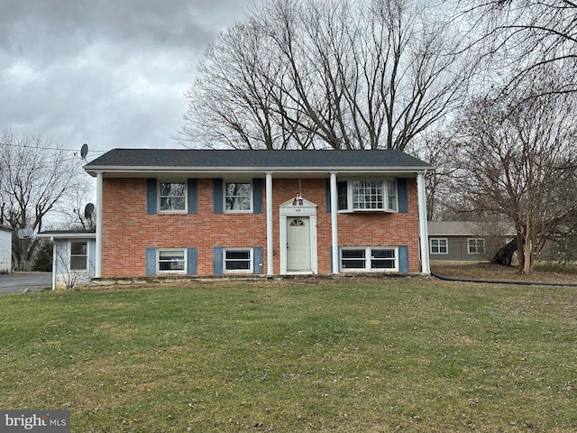 raised ranch featuring a front yard