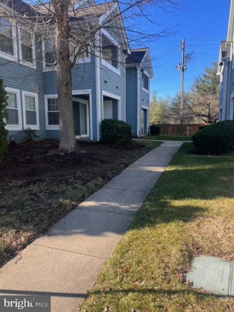 view of property's community with a yard