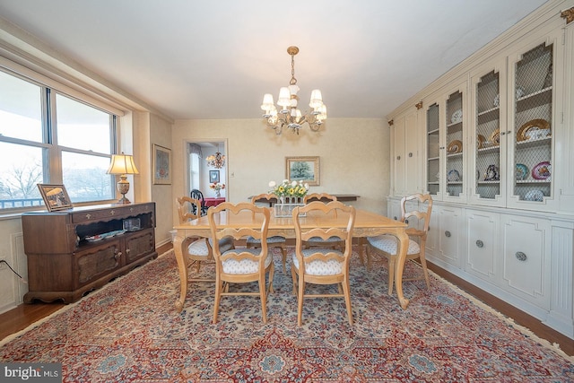 dining room featuring a chandelier and wood finished floors