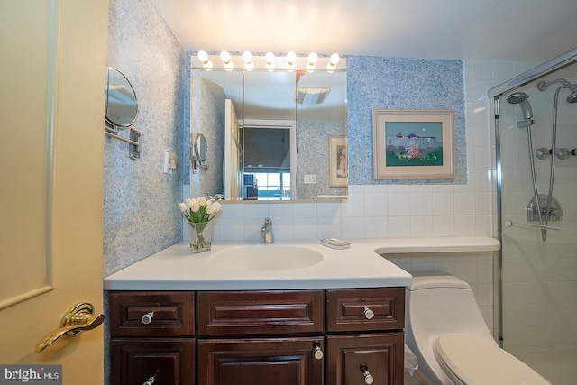 bathroom featuring toilet, tasteful backsplash, tiled shower, and vanity