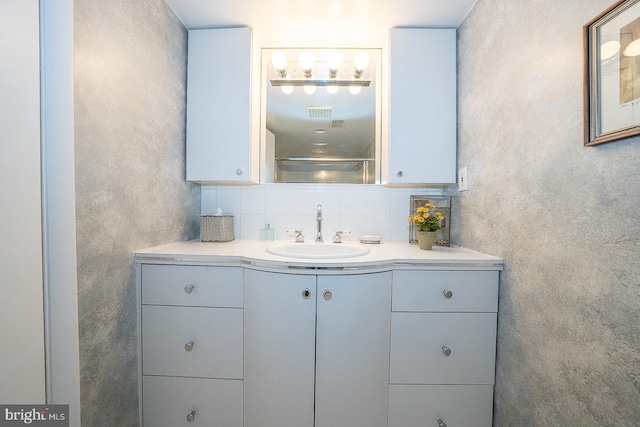 full bathroom featuring a shower, vanity, and decorative backsplash