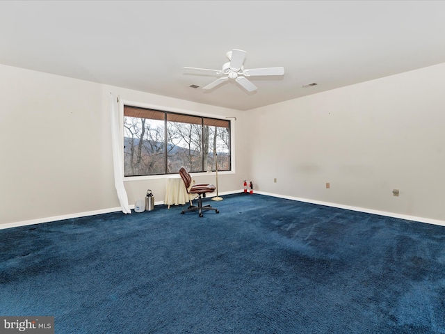 unfurnished room featuring carpet flooring and ceiling fan