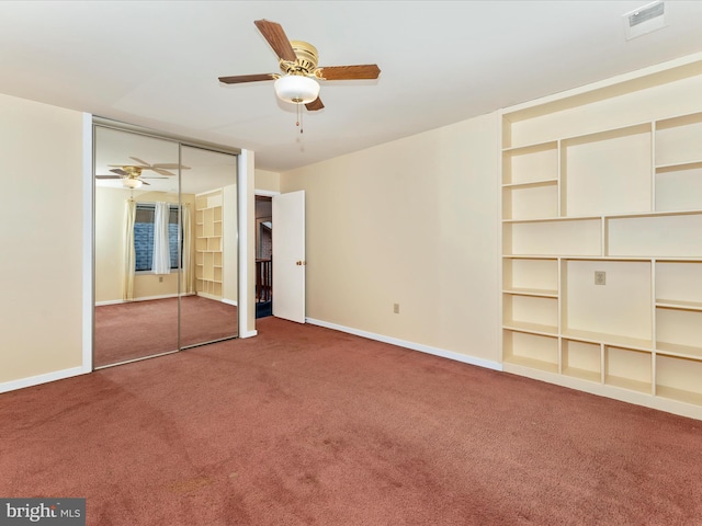 unfurnished bedroom featuring ceiling fan, a closet, and carpet