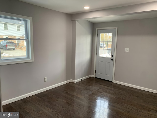 doorway with dark hardwood / wood-style floors