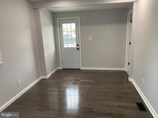 doorway to outside with dark hardwood / wood-style flooring