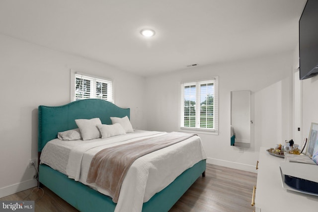 bedroom featuring hardwood / wood-style floors