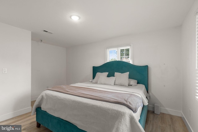 bedroom featuring light wood-type flooring