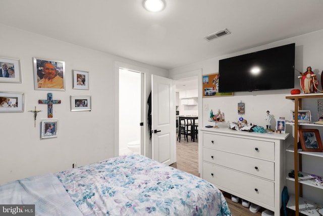 bedroom with light wood-type flooring