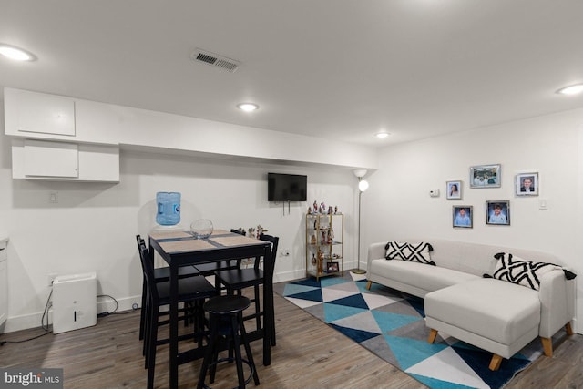 living room featuring dark wood-type flooring