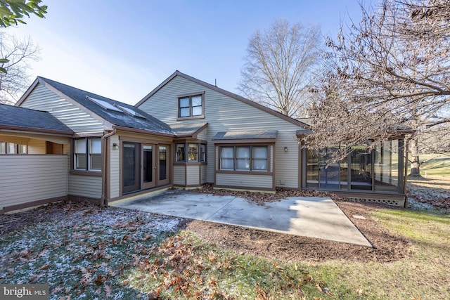 rear view of house with a patio