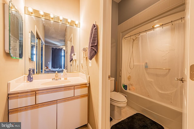 full bathroom with tile patterned floors, vanity, shower / tub combo, and toilet