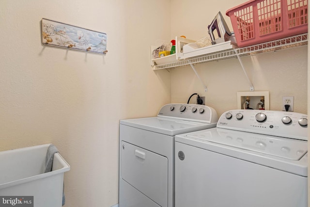 laundry area with washer and clothes dryer