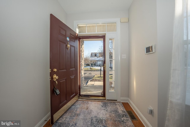 foyer featuring wood-type flooring