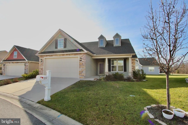 view of front of house featuring a front lawn and a garage