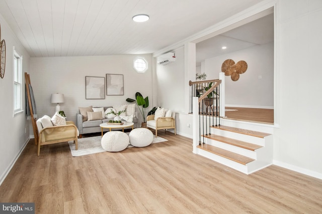 living room featuring wooden ceiling, light hardwood / wood-style flooring, and a wall mounted AC