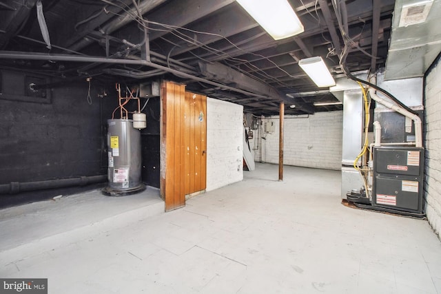 basement with heating unit and water heater