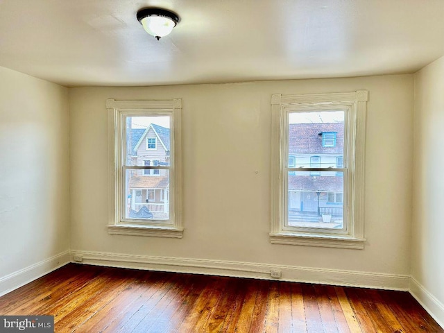 empty room featuring wood-type flooring