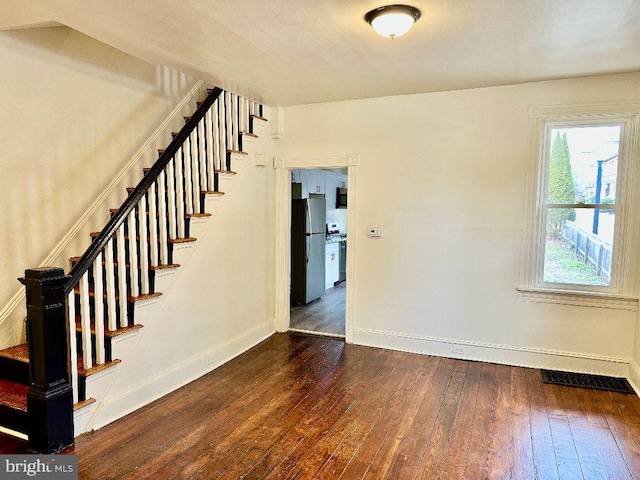 staircase featuring hardwood / wood-style flooring