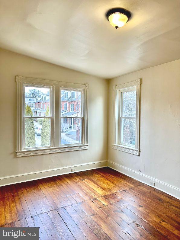 empty room featuring hardwood / wood-style flooring