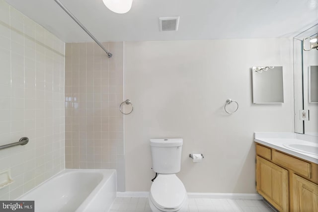 full bathroom with vanity, tiled shower / bath combo, and toilet