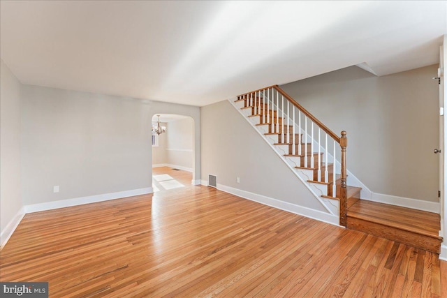 unfurnished living room featuring light hardwood / wood-style flooring