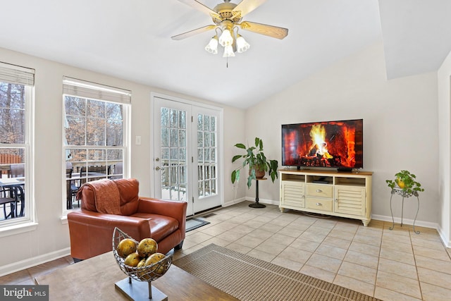 sitting room featuring ceiling fan, lofted ceiling, and light tile patterned floors