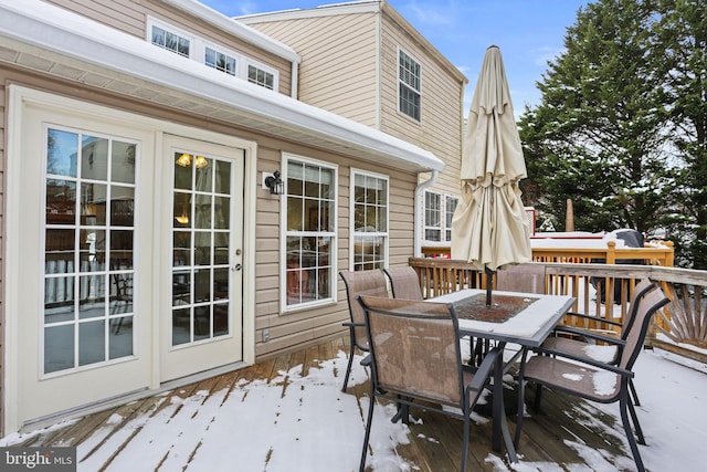 view of snow covered deck