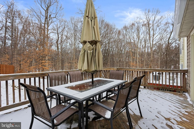 view of snow covered deck