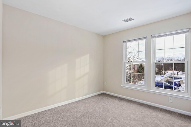 view of carpeted spare room