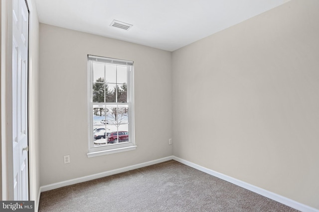 empty room with carpet flooring