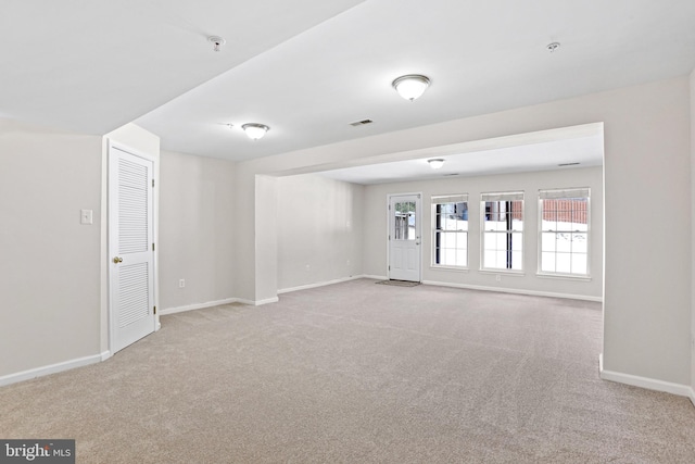 empty room featuring light carpet