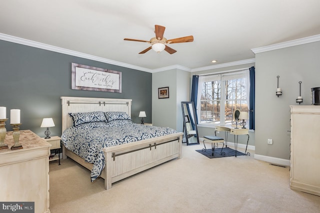 carpeted bedroom with ornamental molding and ceiling fan