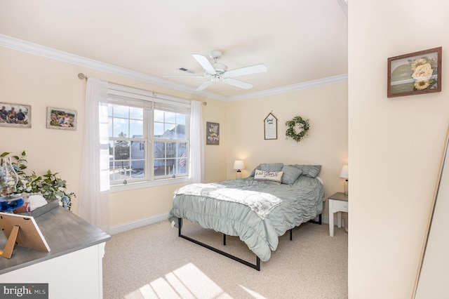 carpeted bedroom featuring ceiling fan and crown molding