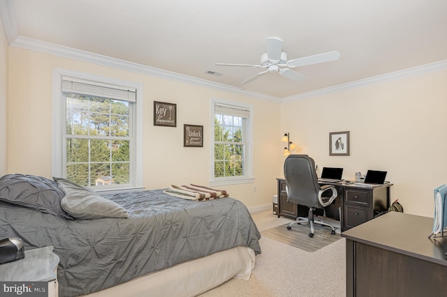 carpeted bedroom featuring ceiling fan, crown molding, and multiple windows