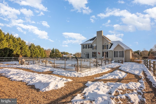 view of snow covered house