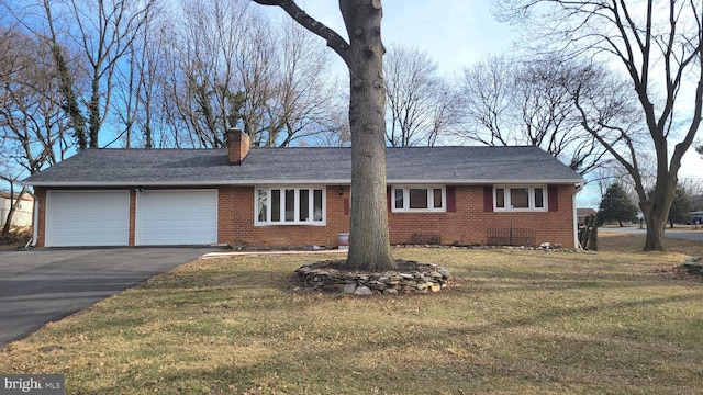 ranch-style house featuring a garage, crawl space, brick siding, and a chimney