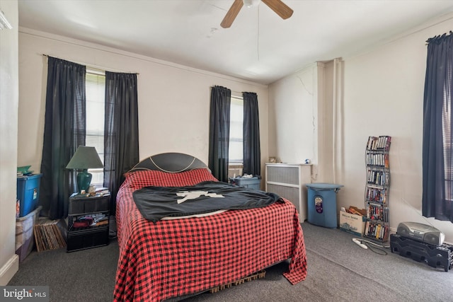 bedroom with ceiling fan and carpet floors