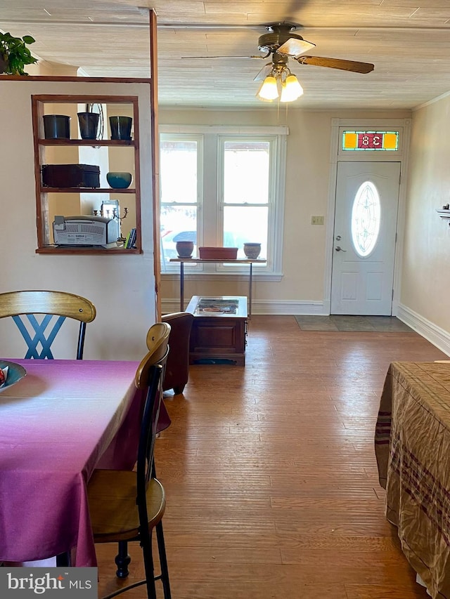 dining room featuring hardwood / wood-style flooring, ceiling fan, and wood ceiling