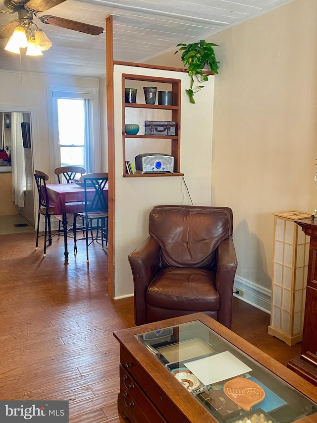 living room featuring hardwood / wood-style flooring and ceiling fan