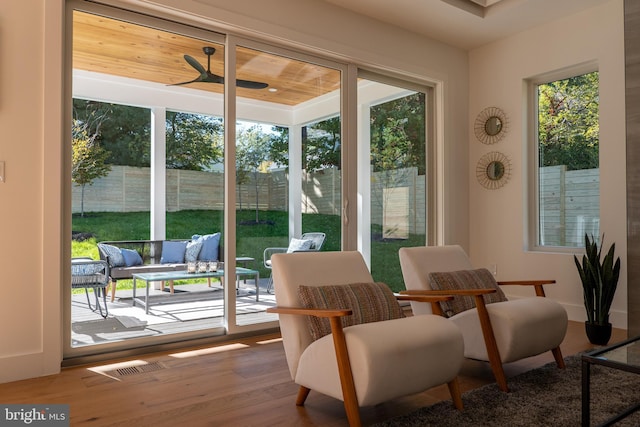 sunroom featuring ceiling fan