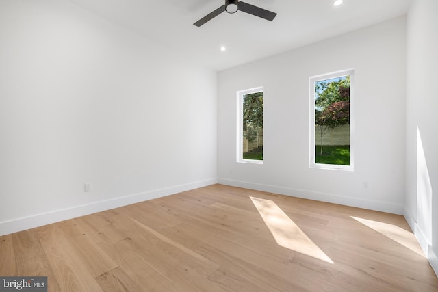 unfurnished room with light hardwood / wood-style flooring and ceiling fan