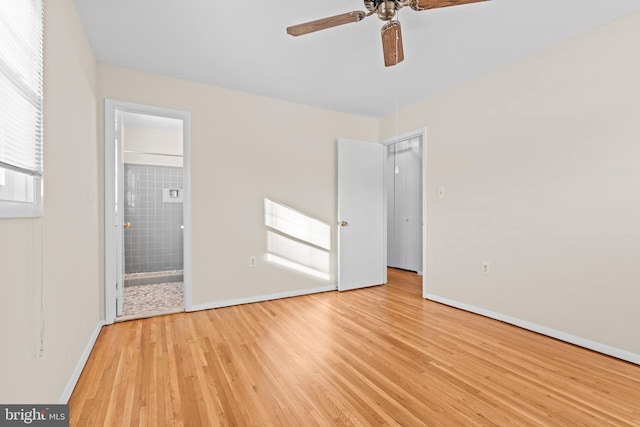 unfurnished bedroom featuring connected bathroom, ceiling fan, and light hardwood / wood-style flooring